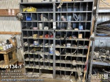 Truck parts cubby hole cabinet with assorted truck parts