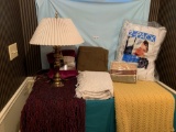 Blankets, pillows and a lamp