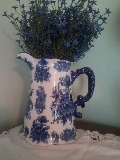 Decorative blue/ white pitcher with flowers