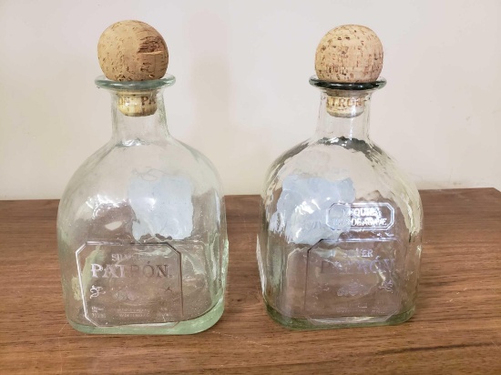 2 silver patron bottles with cork