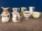 8 small pitchers