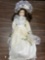 Porcelain Doll with cream color dress / and hat