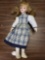 Porcelain doll with blue dress/ white dress