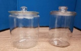 2 clear glass cannisters with lids