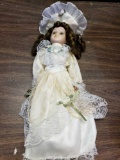Porcelain Doll with cream color dress / and hat