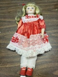 Porcelain doll with red dress