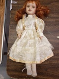 Porcelain doll with Auburn hair