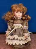 Porcelain doll with green dress