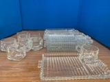 Set of 8 glass trays with matching tea cups