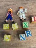 Raggedy Ann and Andy dolls and wooden blocks