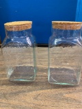 2 glass canisters with wooden cork tops