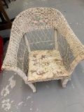 White wicker kids rocking chair with padded seat