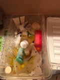 Container full of trial size soaps etc