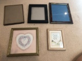 3 picture frames and 2 wall hangings