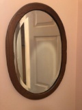Oval wooden beveled mirror