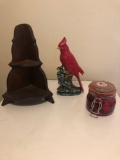 Red bird, wooden corner shelf, candle