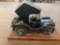 Vintage wooden car on wooden stand