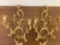 2 gold colored wall candle holders