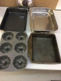 Various metal baking dishes, one lid