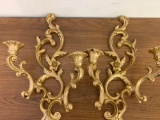 2 gold colored wall candle holders