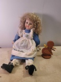 Porcelain Doll and Wooden Duck Paper Holder