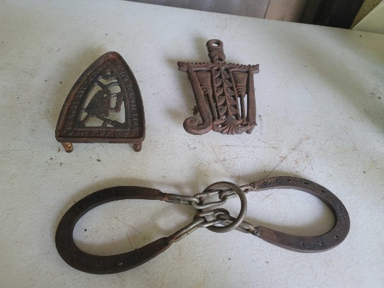 2 Vintage Cast Iron Trivets and 1 Vintage Cast Iron Game