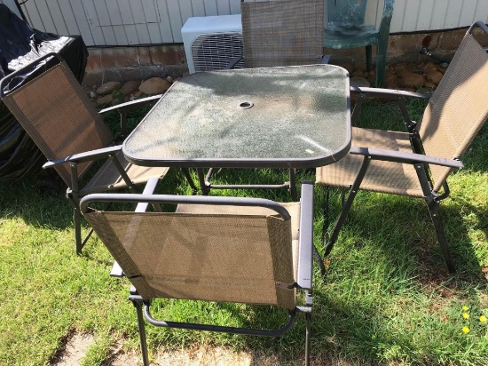 Glass Top Patio table with 4 Folding Chairs