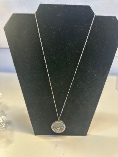 Chain Necklace With A Floating Locket Pendant