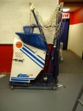 THE GUN BASKETBALL GAME TRAINER W/CASTERED BALL RACK