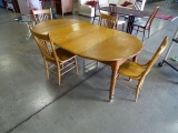 42” ROUND WOOD TABLE TO 79” OVAL 3-LEAFS EACH ONE IS 12” WIDE W/4 CHAIRS