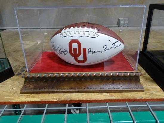 OU FOOTBALL SIGNED BY BOB STOOPS & BARRY SWITZER IN A CASE