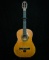 Acoustic guitar autographed by Roy Clark to Chuck Bowman