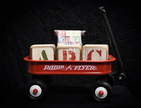 Radio Flyer wagon with wooden ABC blocks