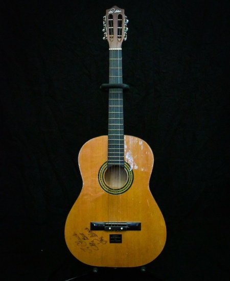 Acoustic guitar autographed by Roy Clark to Chuck Bowman