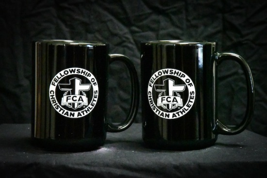 2 black FCA mugs