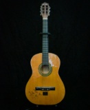 Acoustic guitar autographed by Roy Clark to Chuck Bowman