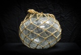 Decorative glass vase with netted rope handle