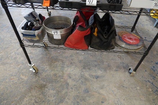 CONTENTS OF SHELF INCLUDING SAW BLADES, TOOL BAGS, BRUSHES & STEEL BALLS