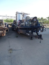 18-FOOT TANDEM AXEL TRAILER W/ WATER PUMP & POWER-WASHING SYSTEMS.