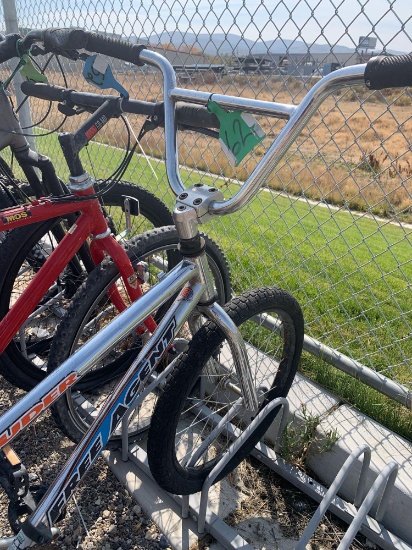 SILVER BMX BIKE, RED SCHWINN BIKE, BLACK SHIMANO BIKE, BLACK MT BIKE.