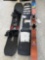 2 snowboards and skiis