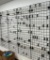 4- 2'x6' Gridwall Panels, Inlcudes Wall Mount Brackets and Peg Hooks Hanging on them