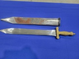 Small Heavy Sword w/ Metal Cover Small heavy metal sword, brass appear handle, is marked India, come