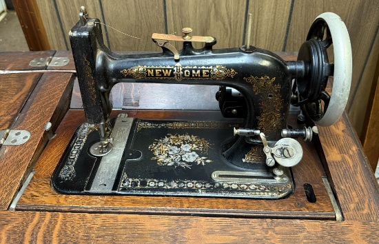 Antique New Home sewing machine in English Oak Case