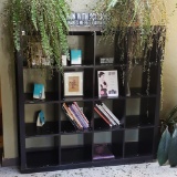 Black shelving unit with contents