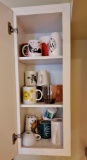 Cabinet contents - mugs and crockpot
