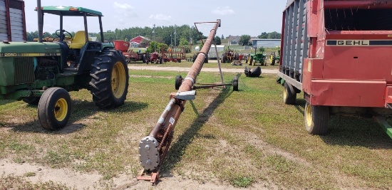 White Farm Equipment auger on transport