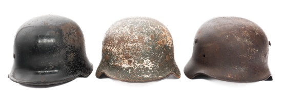 WWII GERMAN DUG RELIC FIREMAN & COMBAT HELMETS