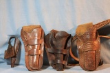 3 vintage holsters and 1 long knife sheath