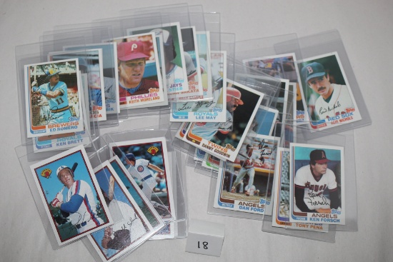 Assorted Baseball Cards In Plastic Sleeves